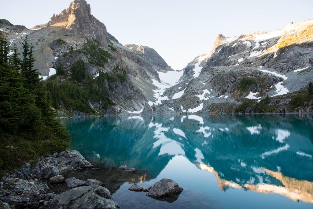 A perfectly calm lake in Washington's Cascade Range at sunrise [OC