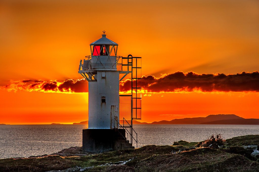 Sunset sun sky clouds sea beach lighthouse landscape wallpaper